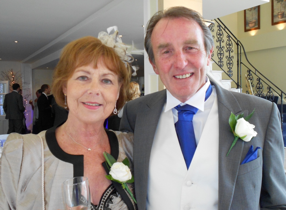 Sue and her husband Short haired brunette lady and husband