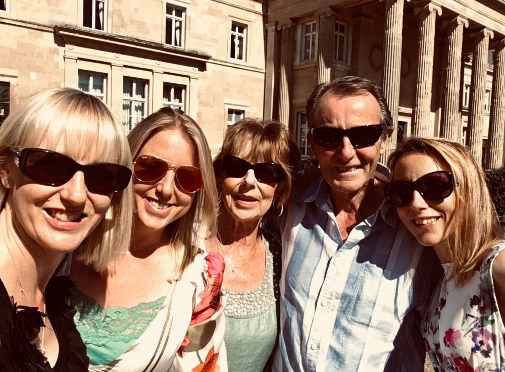 4 ladies and man smiling at camera